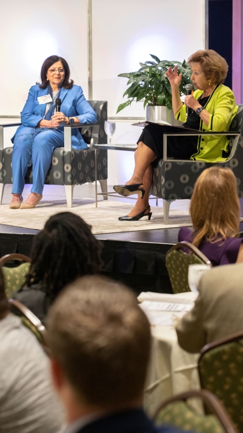 Zucker, Thornely seated on stage.jpg